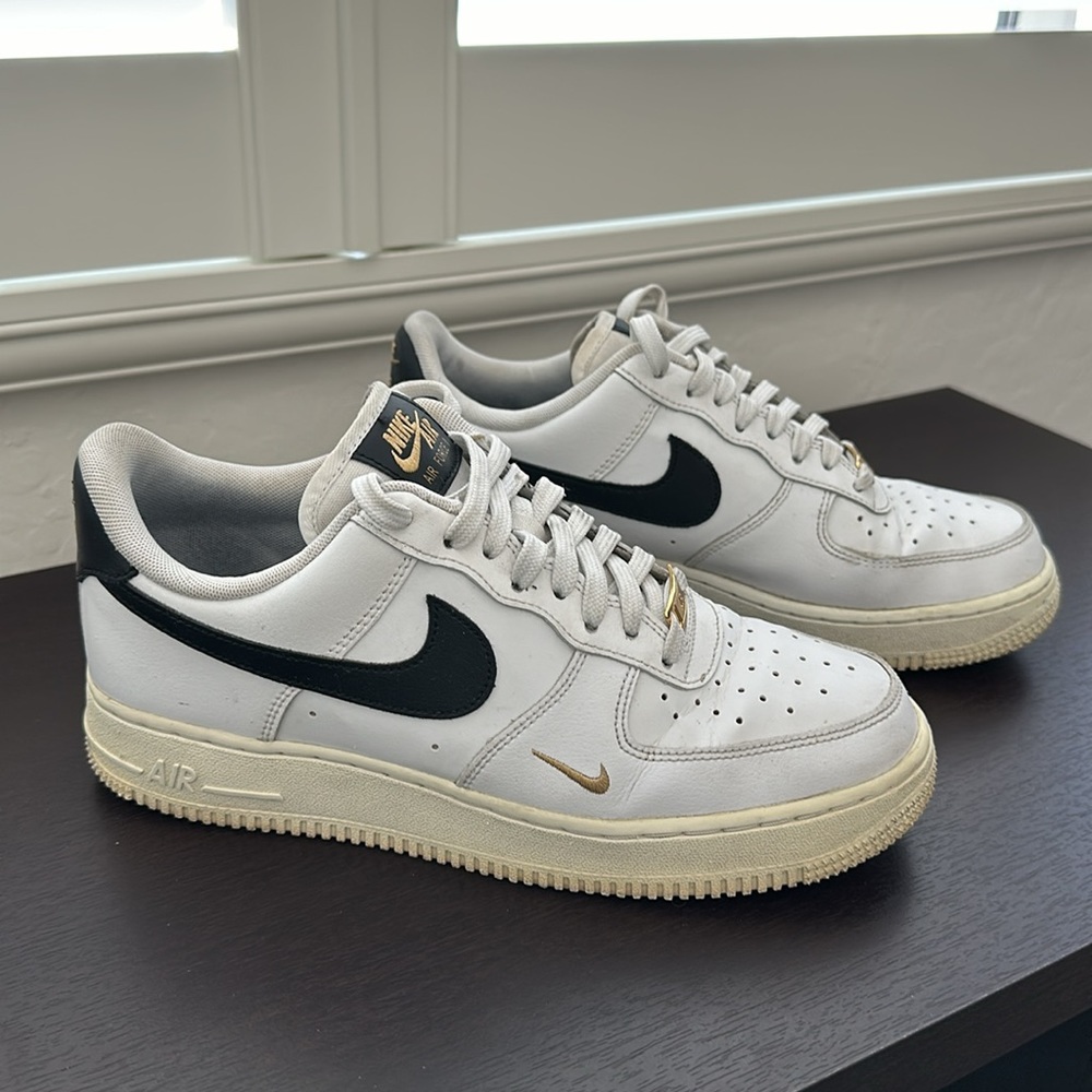 Nike Air Force 1 white and black with gold Mini Swoosh